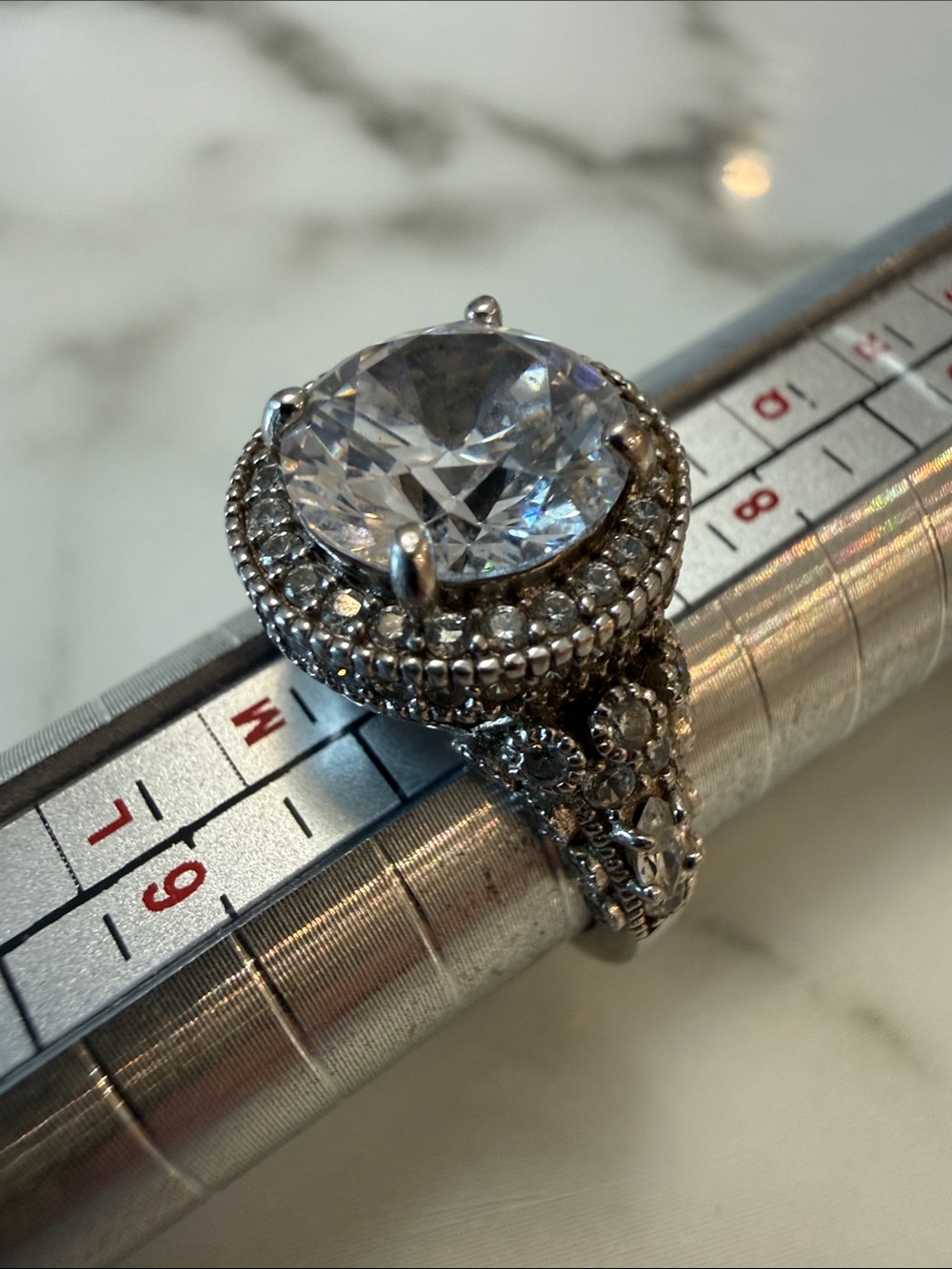 Silver halo ring with clear stones, size 7
